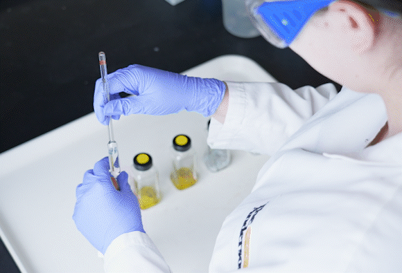 Lab worker creating fertilizer with science