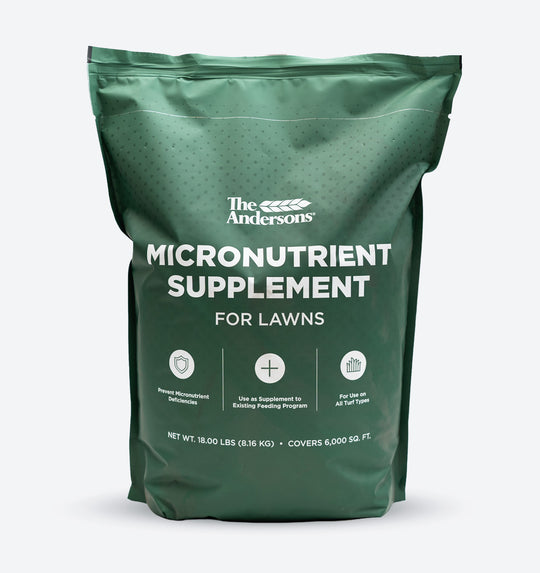 A green stand-up pouch of The Andersons Micronutrient Supplement for lawns, shown on a light gray background.
